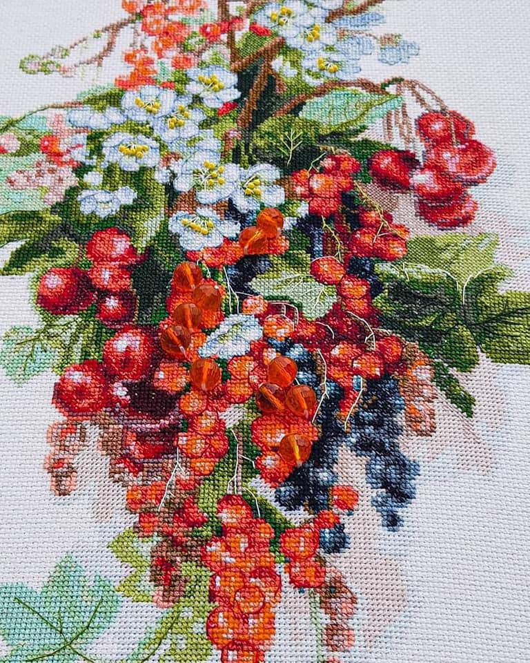 Cross-stitch kit M-266C 'Sweet berry' featuring colorful threads, Aida fabric, beads, and a needle, perfect for embroidery enthusiasts.