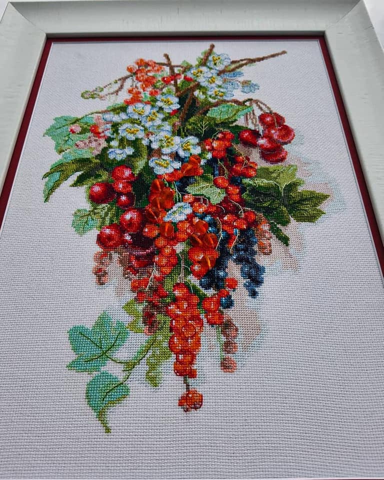 Cross-stitch kit M-266C 'Sweet berry' featuring colorful threads, Aida fabric, beads, and a needle, perfect for embroidery enthusiasts.