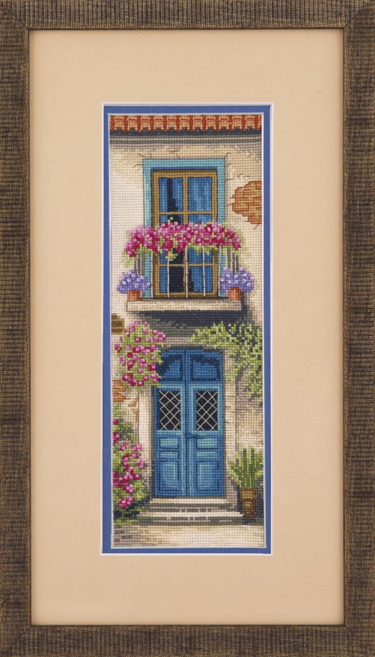 Cross-stitch kit M-286C Cozy Province with colorful threads, beads, and Aida fabric for crafting.