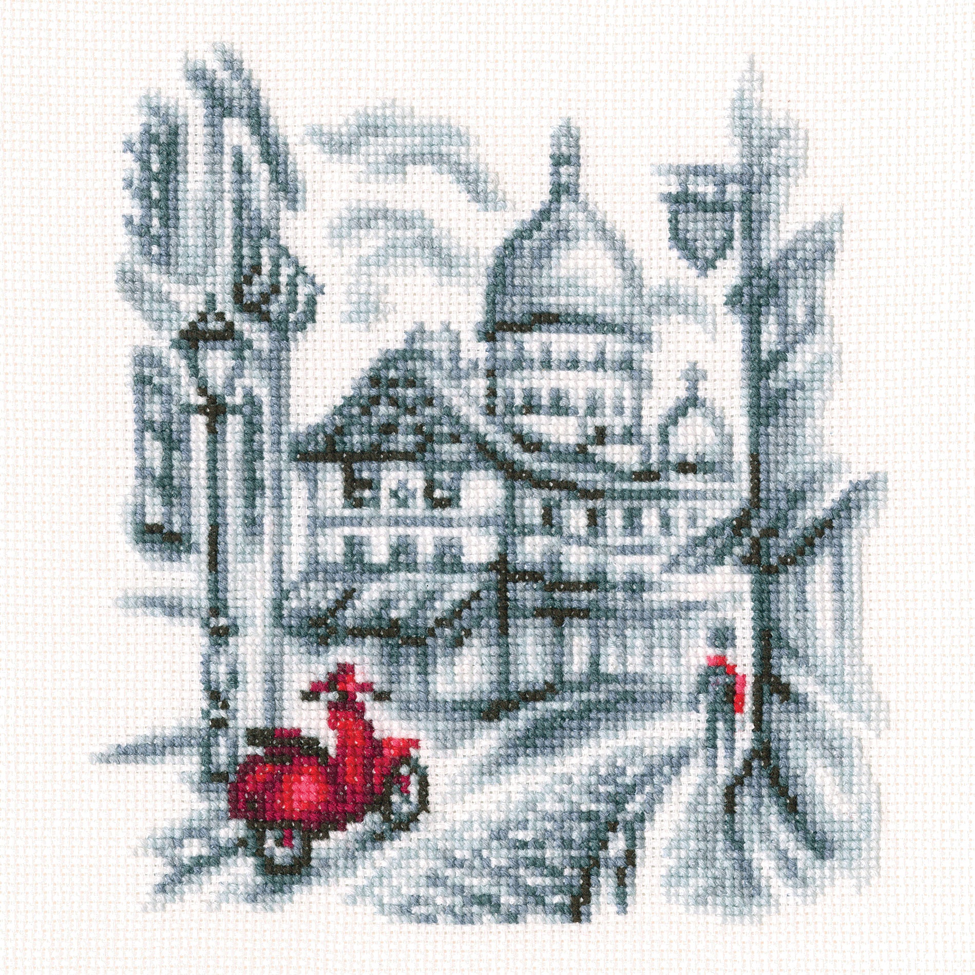 Cross-stitch kit featuring a Parisian street scene with Aida fabric, DMC threads, and all necessary tools for crafting.