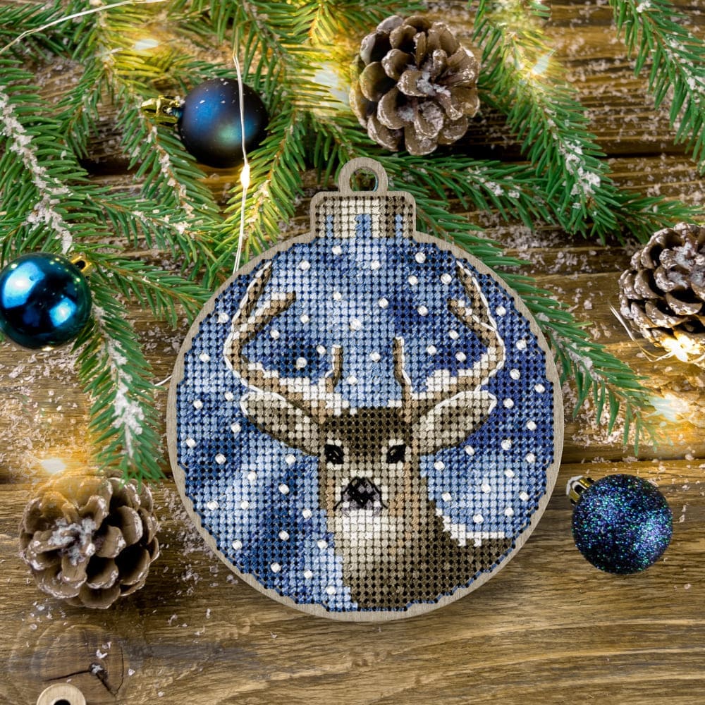 Cross-stitch kit on wood FLW-017 featuring colorful threads, beads, and a wooden blank for creating Christmas tree decorations.