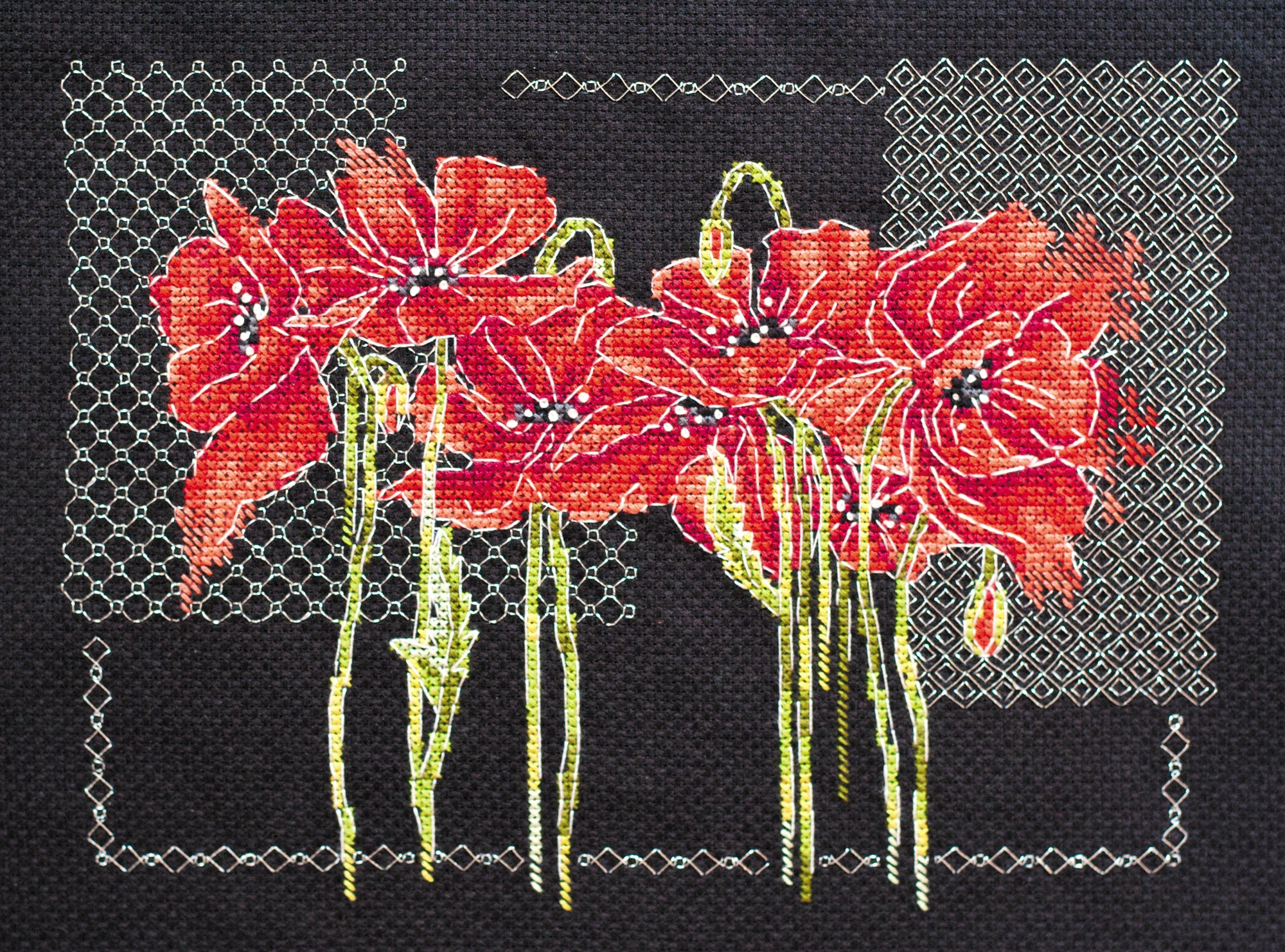 Cross-stitch kit Poppies AH-138 featuring black cotton canvas, colorful floss, and metallic thread for vibrant stitching.