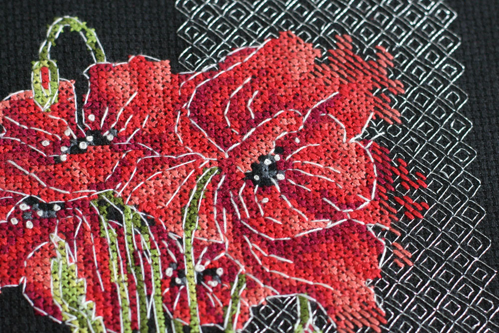 Cross-stitch kit Poppies AH-138 featuring black cotton canvas, colorful floss, and metallic thread for vibrant stitching.