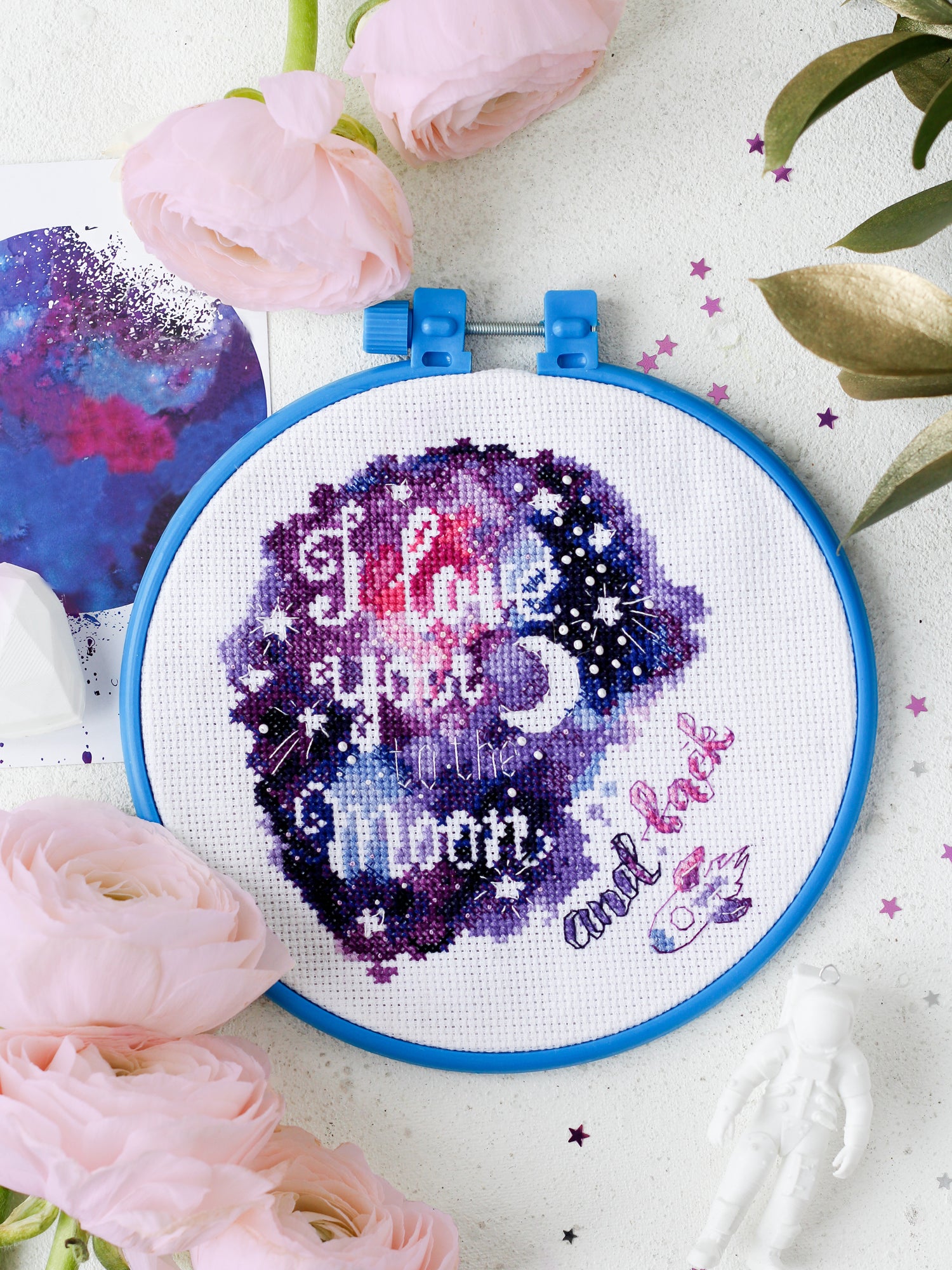 Cross-stitch kit To the Moon and Back AHM-034 featuring blue cotton canvas, colorful floss, and bead embroidery supplies.