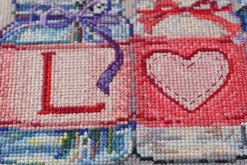 Cross-stitch kit With tender and love AH-053 featuring cotton canvas, colorful floss, and instructions in multiple languages.