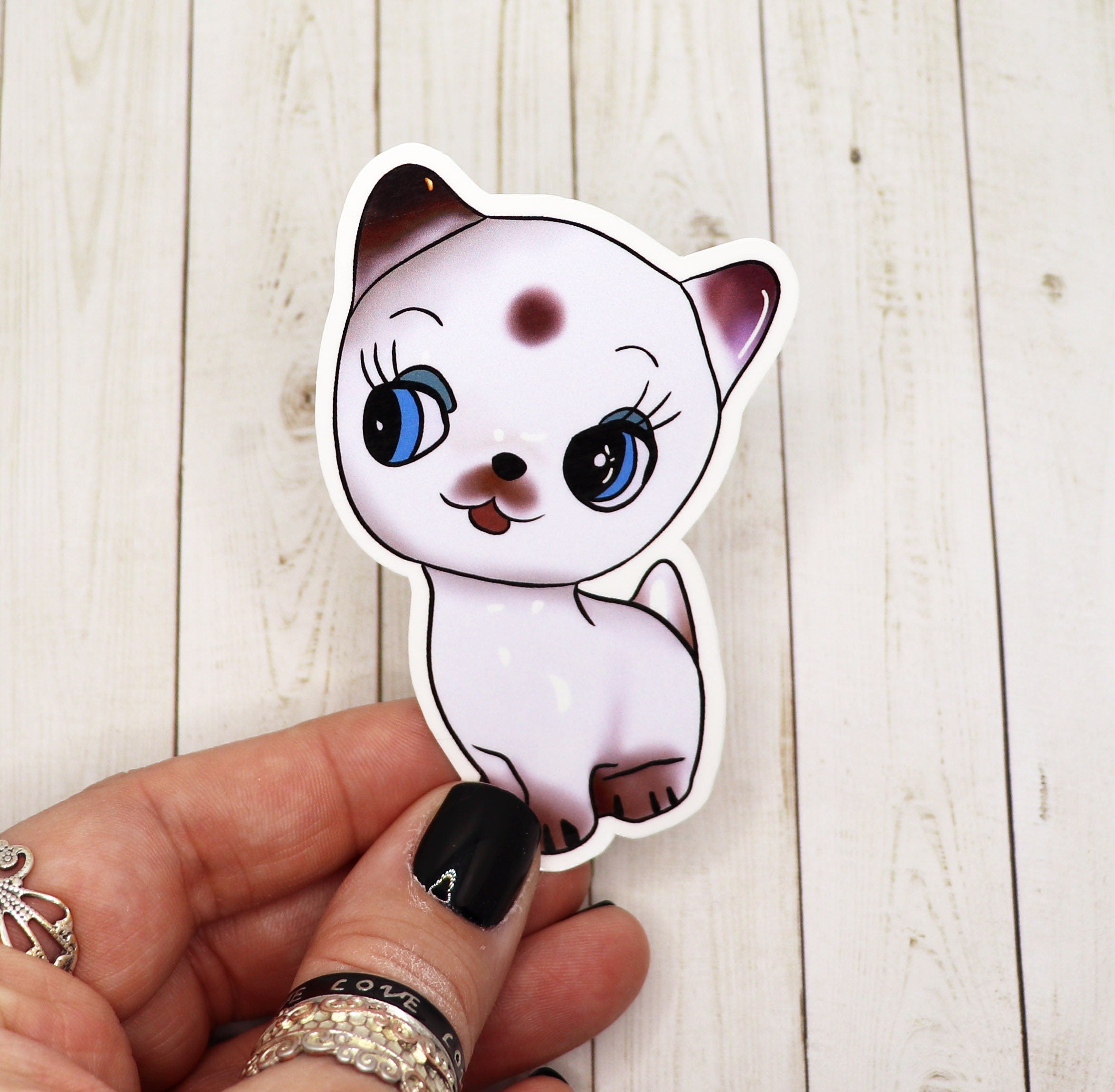 A cute cat sticker featuring an adorable cat design on high-quality matte vinyl.