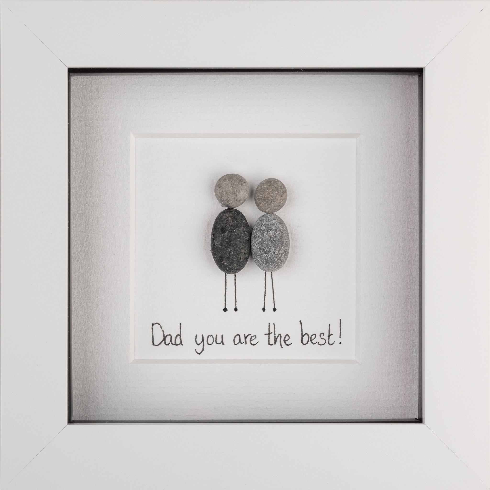 A stylish pebble picture framed in black or white, celebrating dads with the phrase 'Dad you are my rock!'