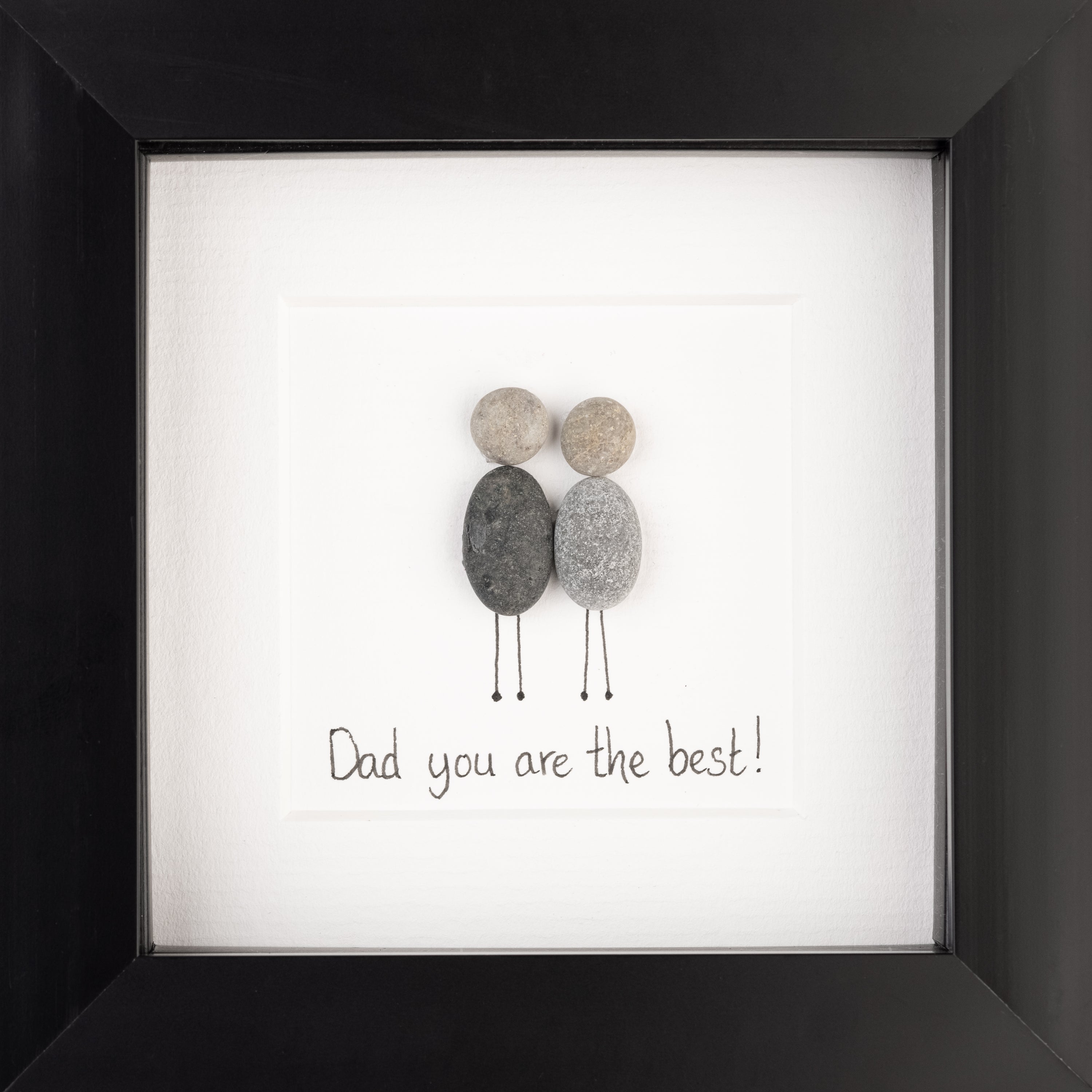 A stylish pebble picture framed in black or white, celebrating dads with the phrase 'Dad you are my rock!'