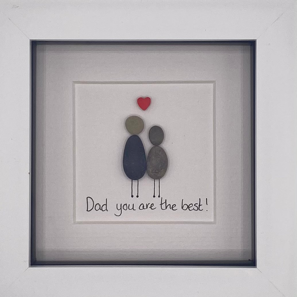 A beautiful pebble picture framed in black or white, celebrating the best dads with a unique design.