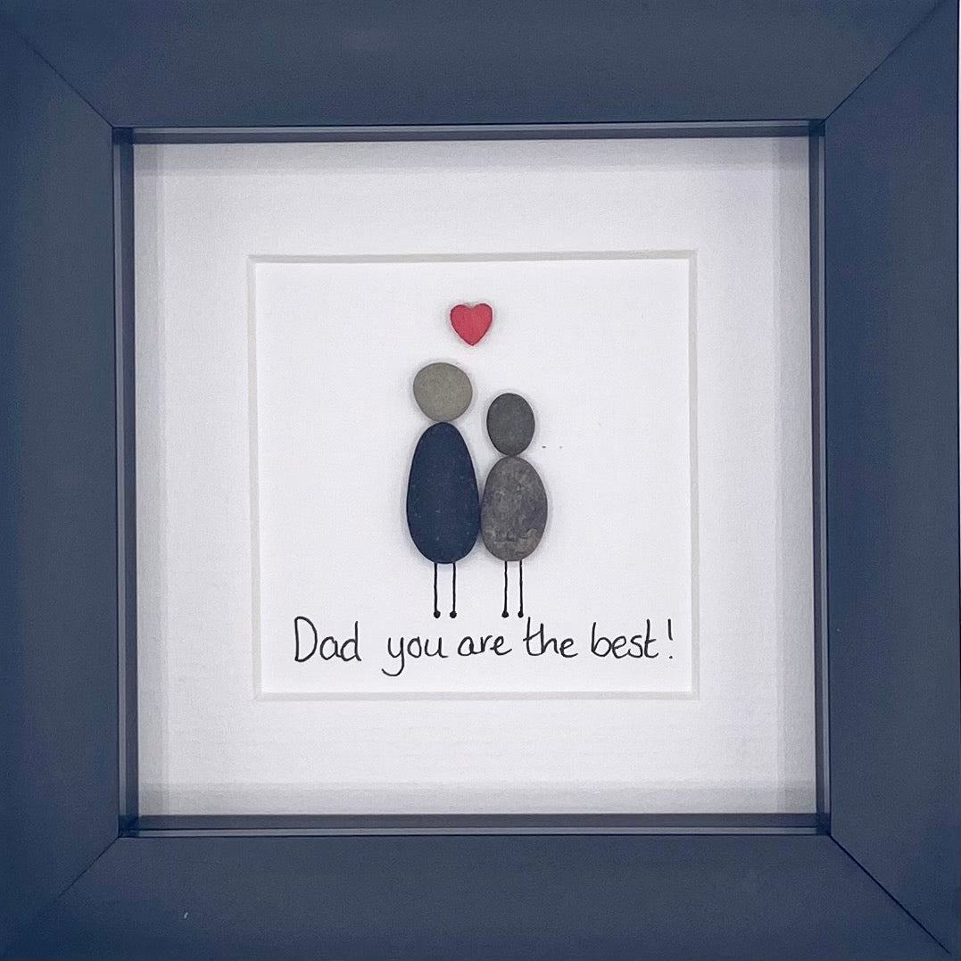 A beautiful pebble picture framed in black or white, celebrating the best dads with a unique design.