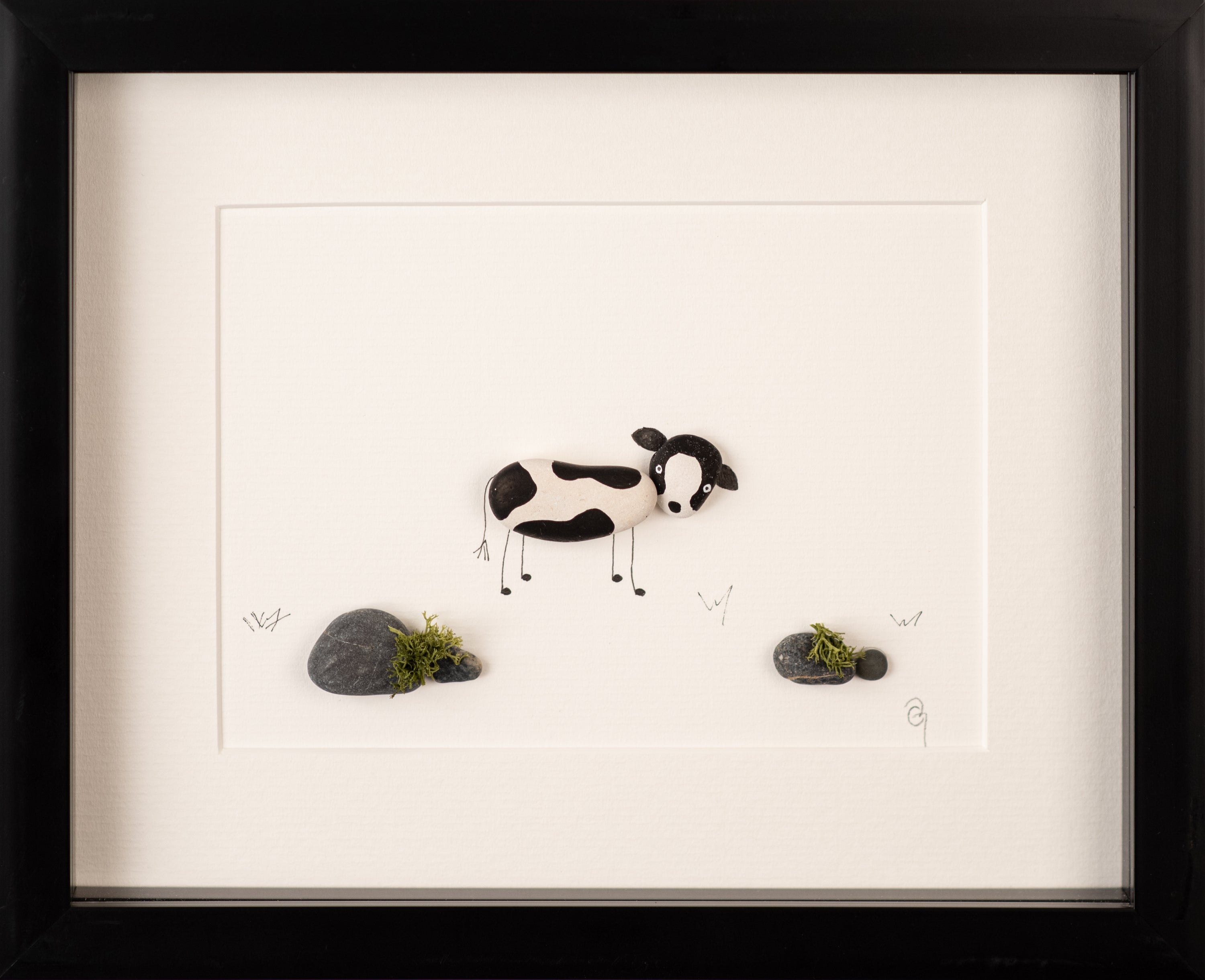 A beautifully framed Dairy Cow artwork showcasing a playful cow in a natural setting, perfect for home decor.