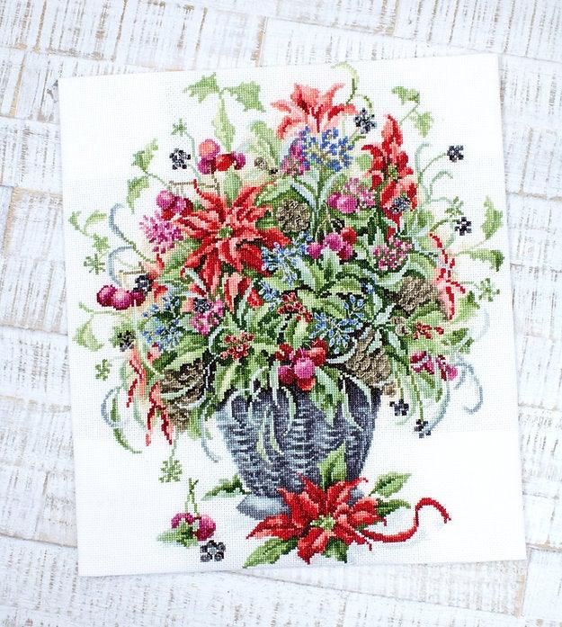 December Bouquet B7002L Counted Cross-Stitch Kit featuring Aida canvas, vibrant threads, and needle for crafting.