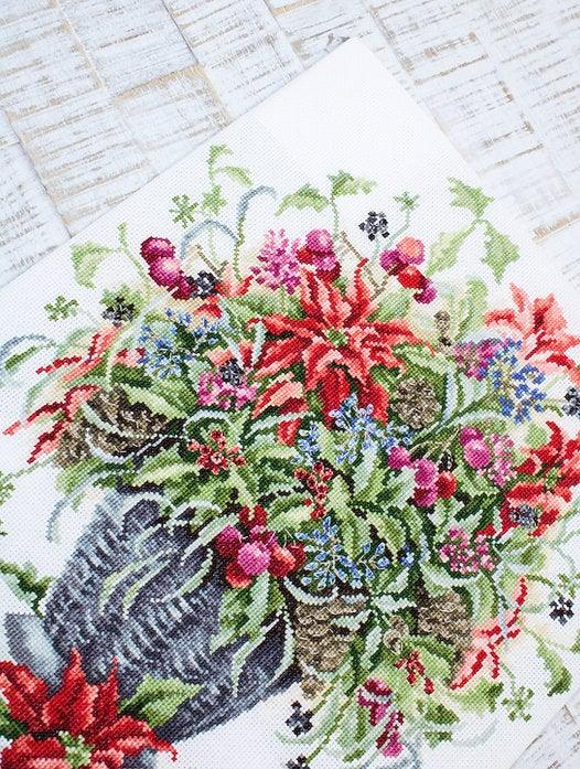 December Bouquet B7002L Counted Cross-Stitch Kit featuring Aida canvas, vibrant threads, and needle for crafting.