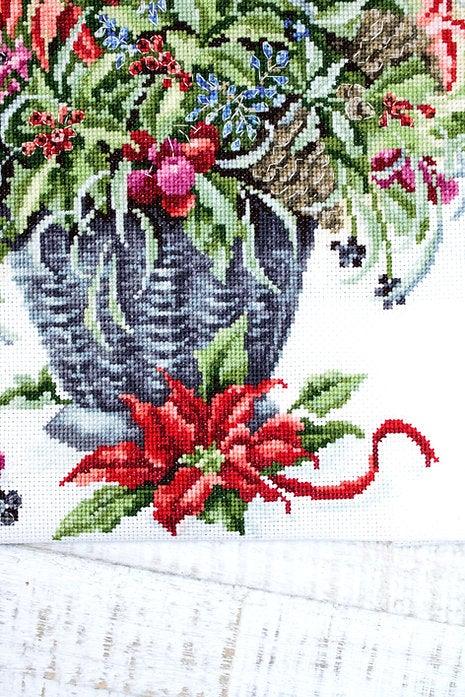 December Bouquet B7002L Counted Cross-Stitch Kit featuring Aida canvas, vibrant threads, and needle for crafting.