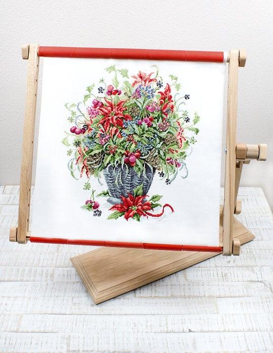 December Bouquet B7002L Counted Cross-Stitch Kit featuring Aida canvas, vibrant threads, and needle for crafting.