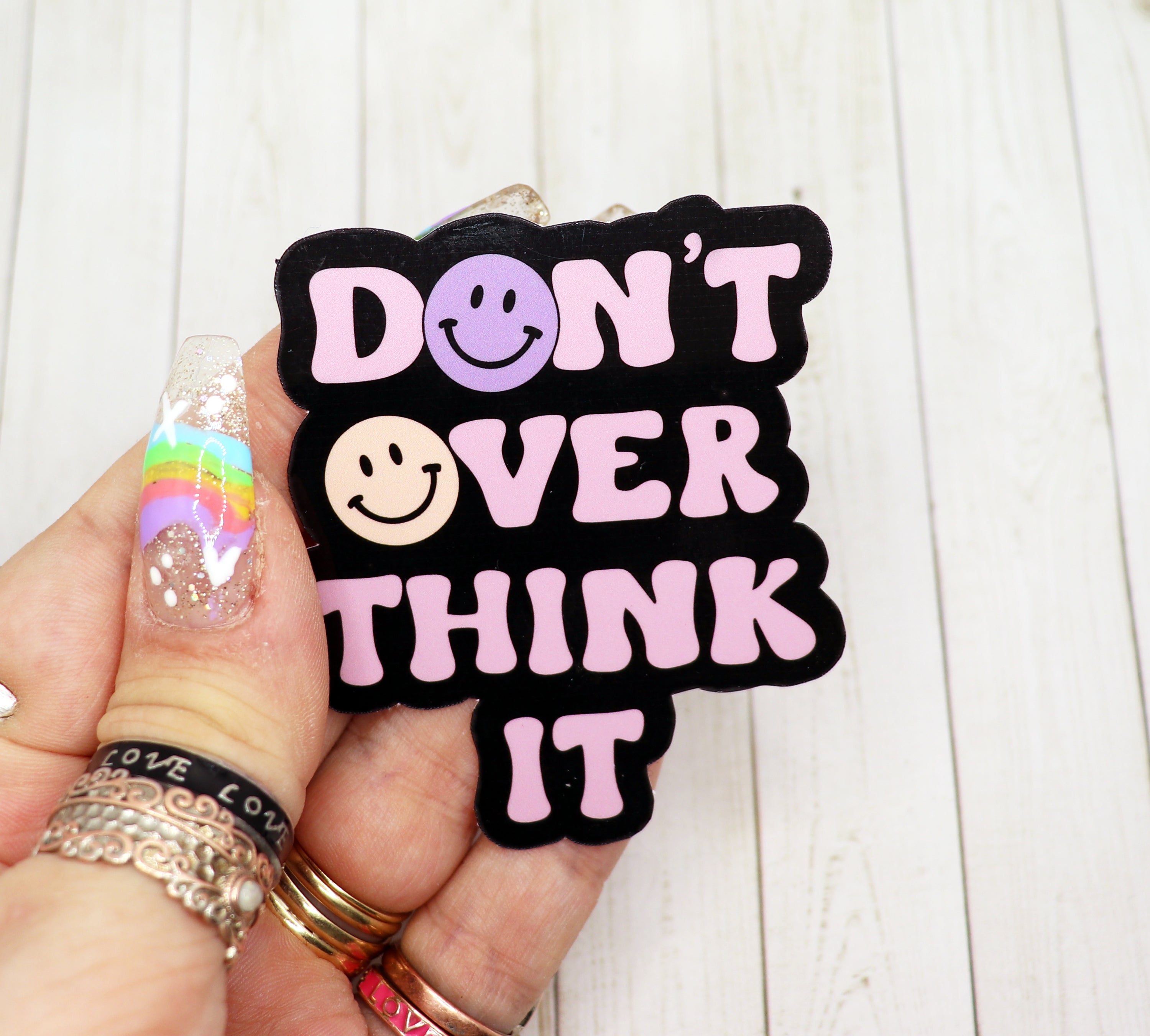 Don't Over Think It Vinyl Sticker on a white background, showcasing its matte finish and motivational design.