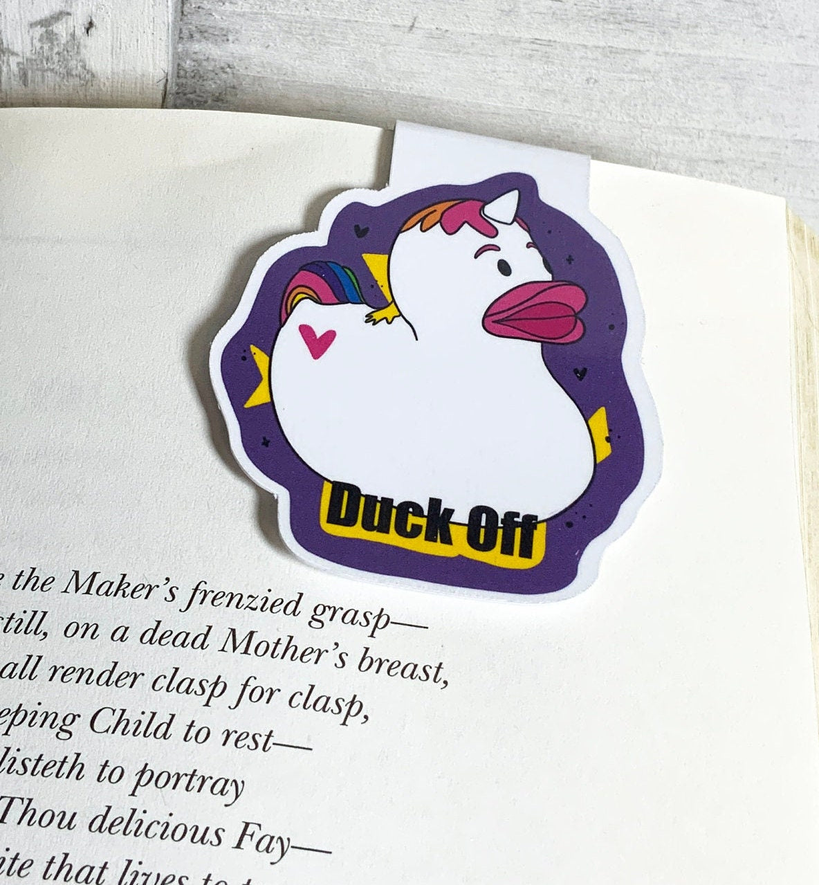 Duck Off Magnetic Bookmark featuring a playful design, measuring 2 inches wide by 2.5 inches tall, with strong magnets and a durable finish.