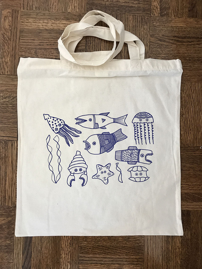 El Nido French Blue Tote featuring marine life silkscreen print in bold blue, made of 100% cotton.