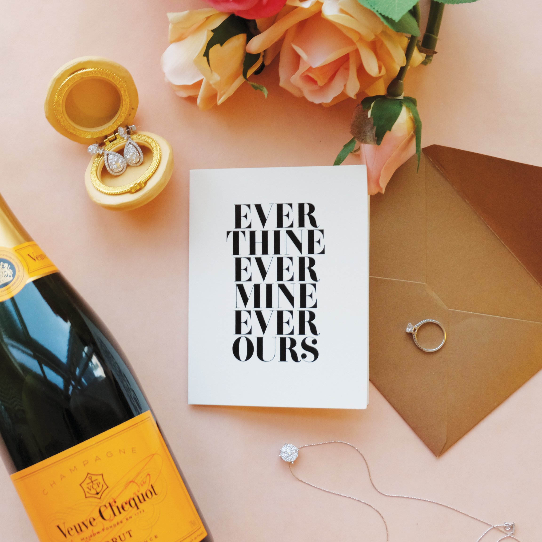 Ever Ours card featuring romantic design with a gold envelope, soft textured stock, and black foil accents.