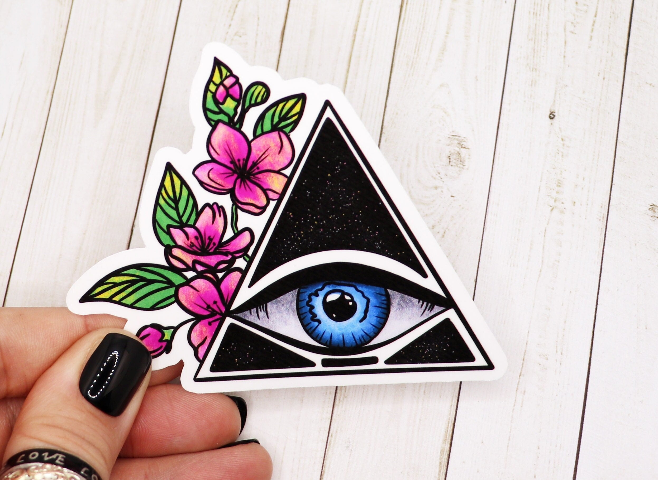 A high-quality Eye of Providence sticker featuring the all-seeing eye design on matte vinyl, perfect for personalizing various items.