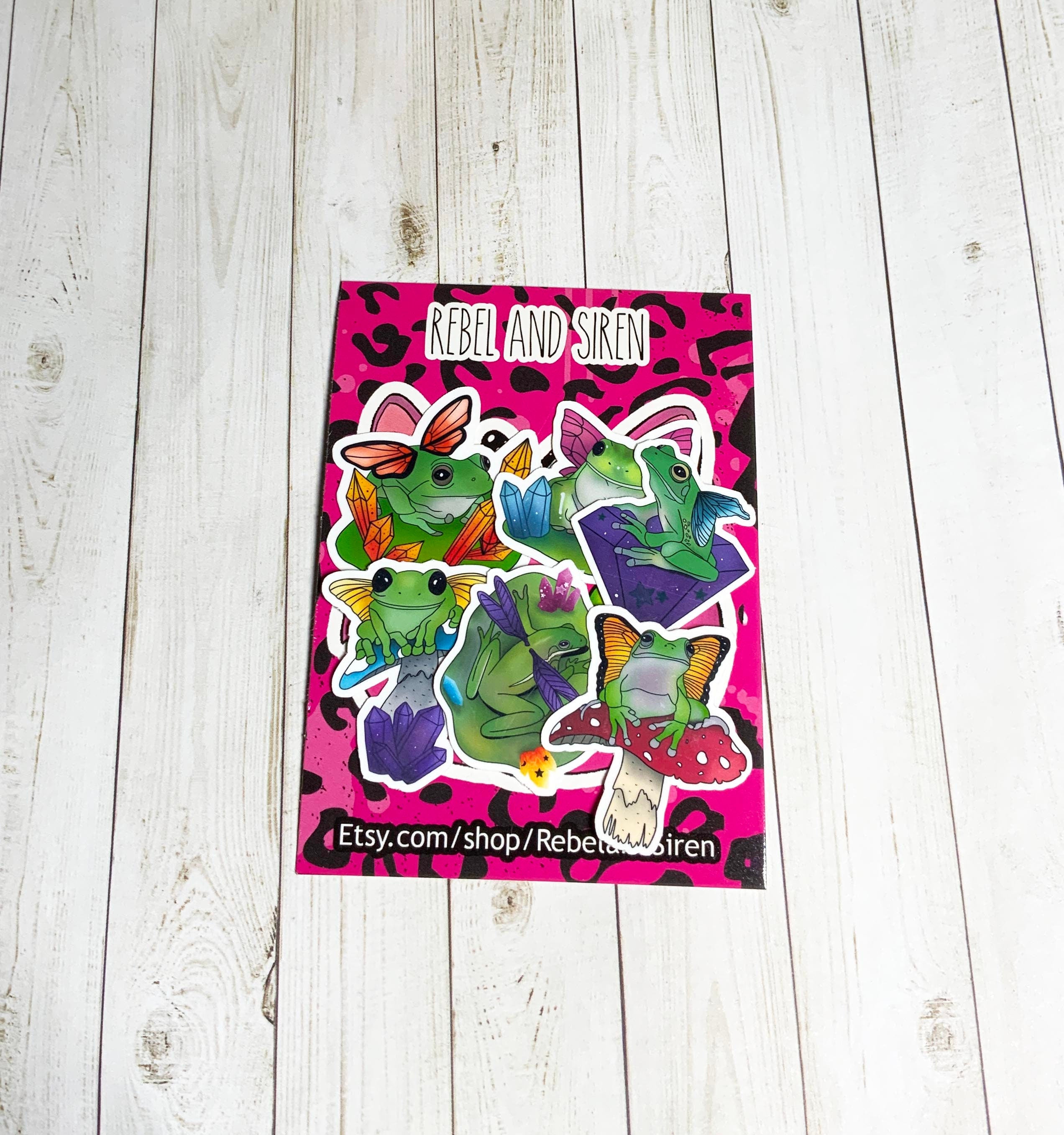 A colorful pack of six fairy frog stickers, showcasing whimsical designs on high-quality matte vinyl.