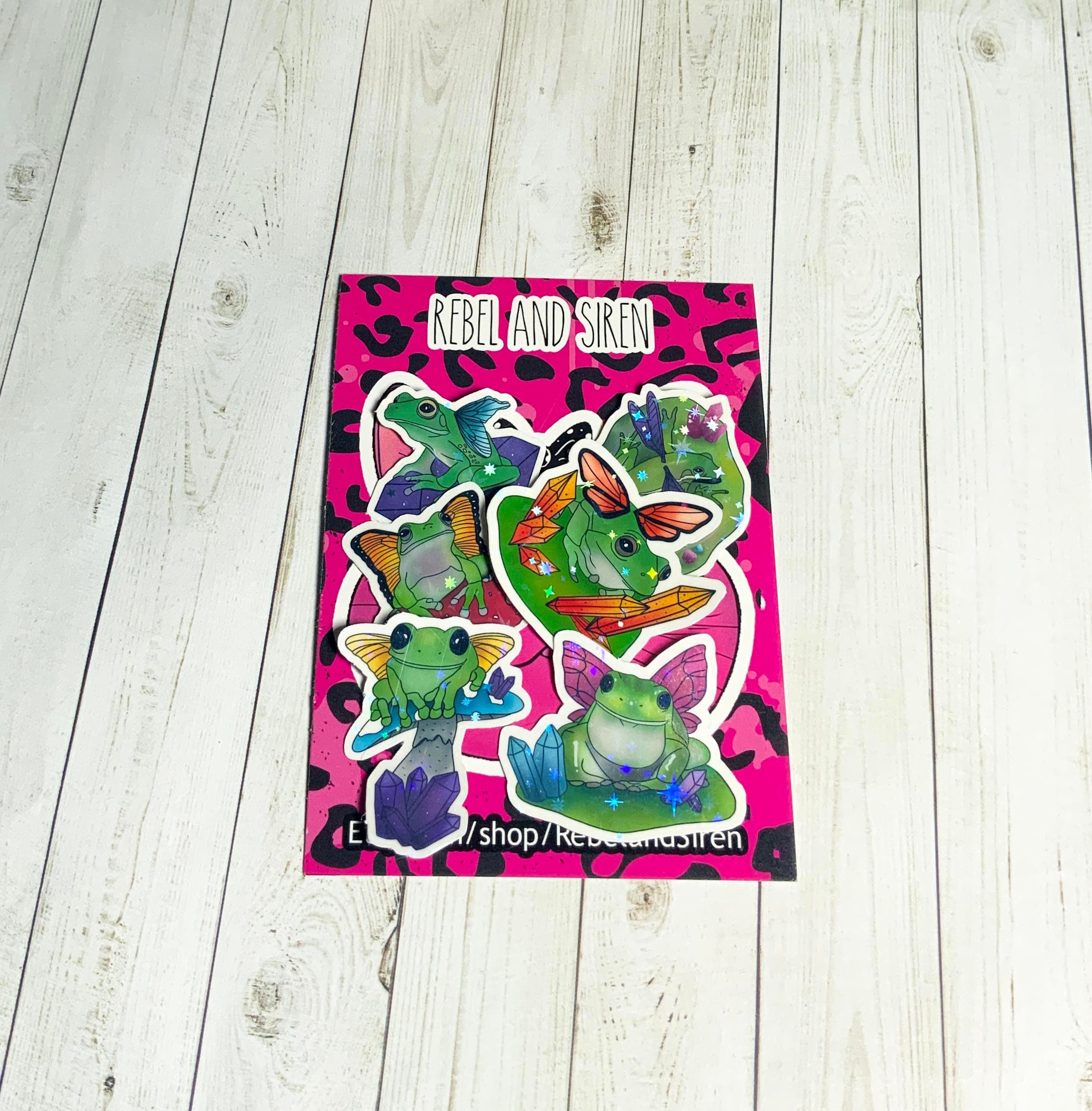 A colorful pack of six fairy frog stickers, showcasing whimsical designs on high-quality matte vinyl.