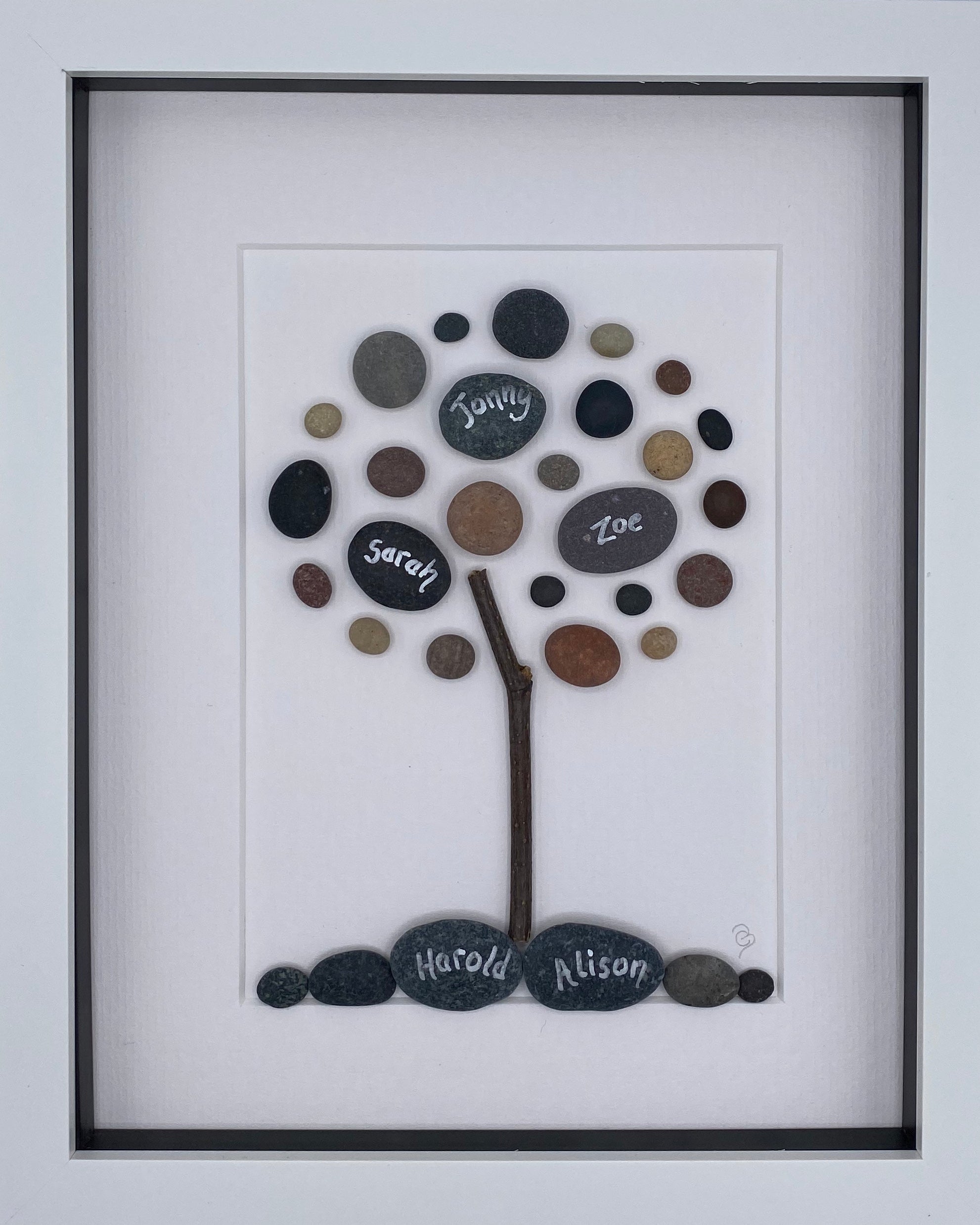 A beautifully designed Family Tree artwork featuring personalized names of family members, framed in black or white.