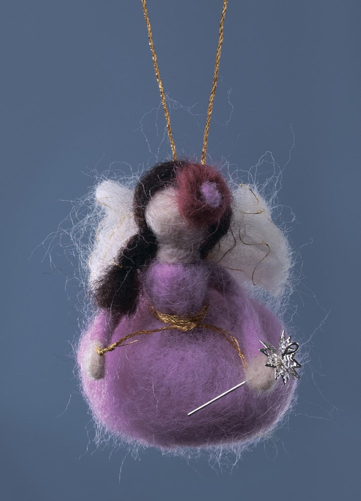 Felting kit V-26C 'Flower Fairy' with colorful wool, needles, and embellishments displayed on a table.