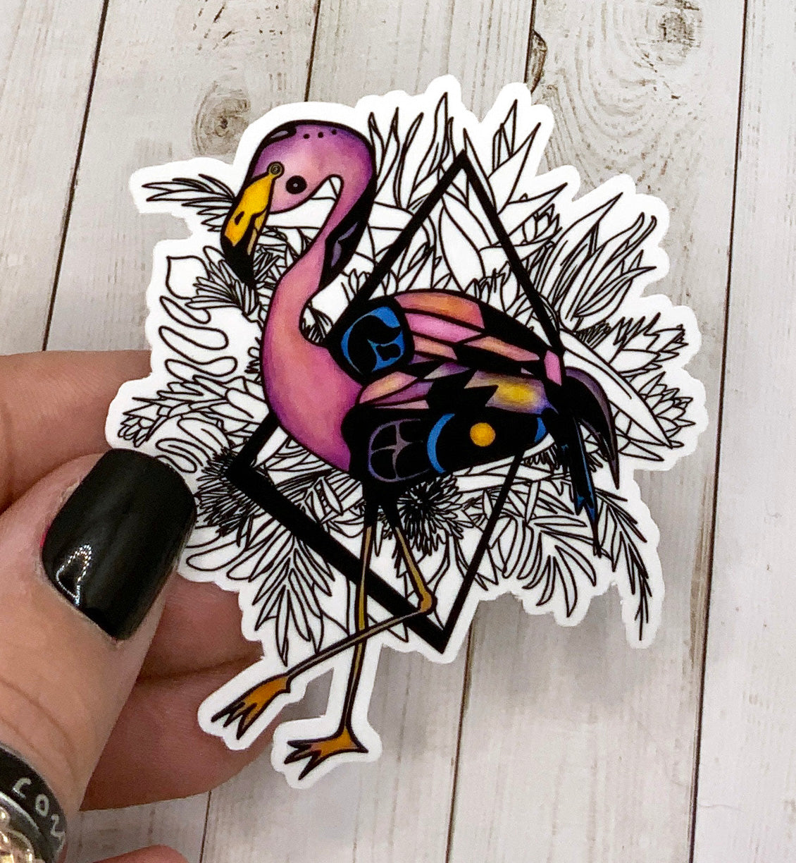 A vibrant flamingo sticker on a white background, showcasing its colorful design and matte finish.