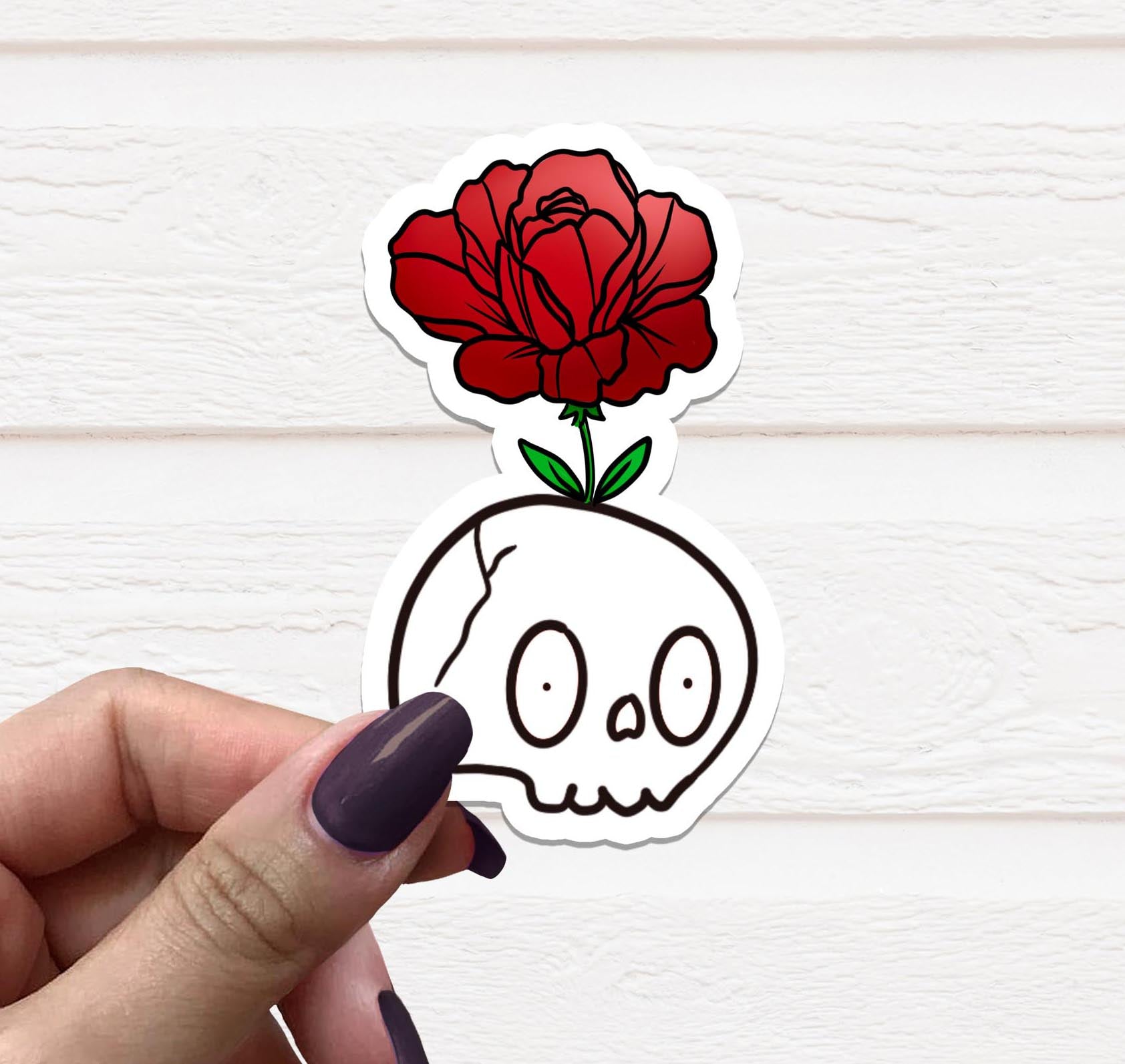 A vibrant Flower Skull Vinyl Sticker featuring a floral skull design on a matte background, perfect for personalizing various items.