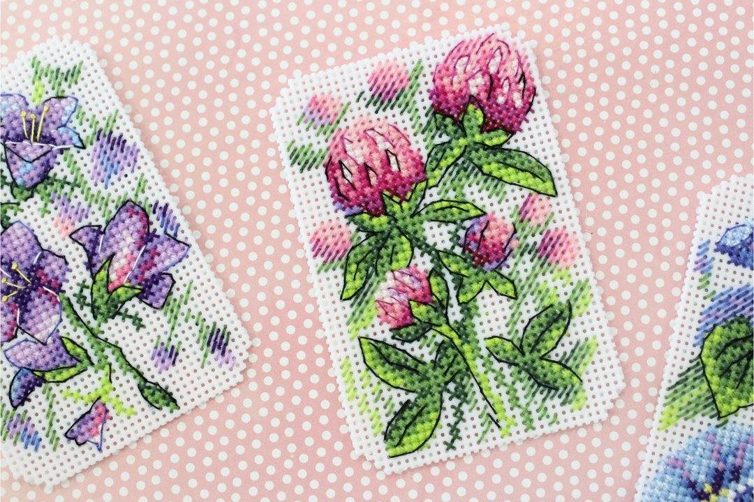 Flower Symphony P-491 / SR-491 Plastic Canvas Counted Cross Stitch Kit with threads, canvas, and instructions for DIY fridge magnets.