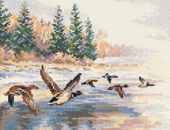 Flying Ducks 3-27 Cross-stitch kit with white aida fabric, colorful threads, and an embroidery needle.