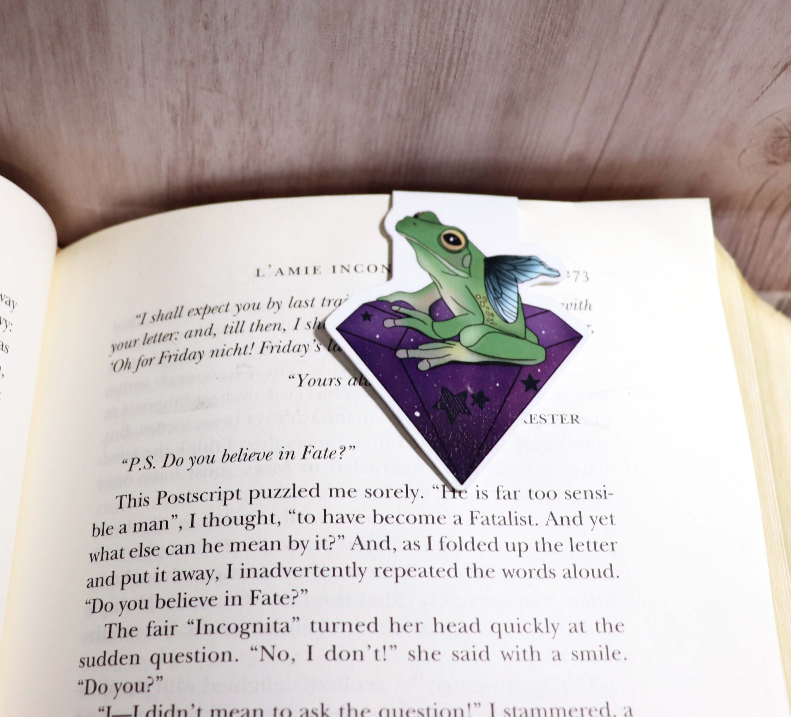 A vibrant Frog Crystal Bookmark featuring a double-sided design with a charming frog illustration, showcasing its scratch and splash resistant qualities.