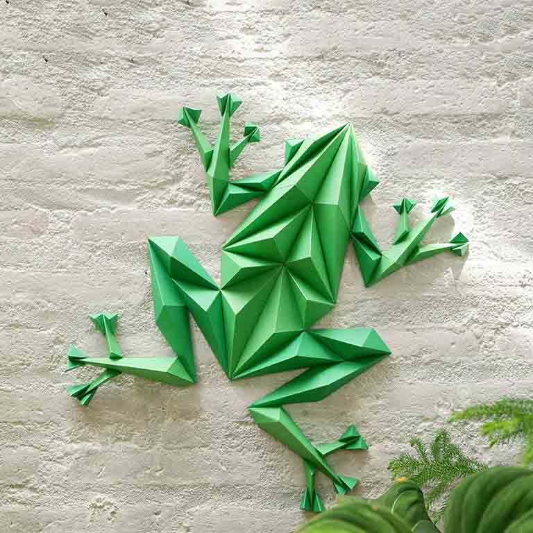 Colorful Frog Wall Art paper craft kit with pre-cut pieces, showcasing a charming frog design ready for assembly.