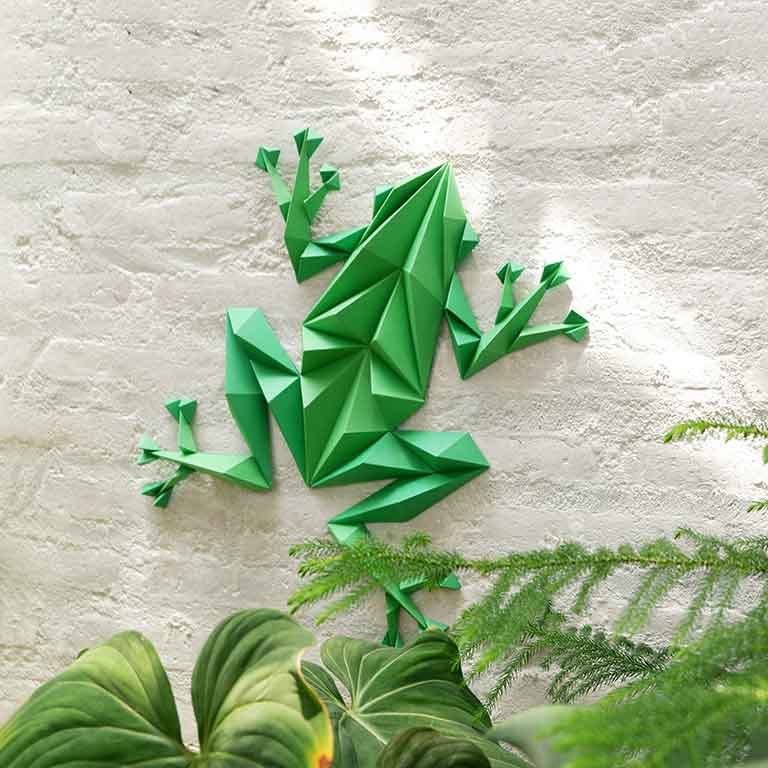 Colorful Frog Wall Art paper craft kit with pre-cut pieces, showcasing a charming frog design ready for assembly.