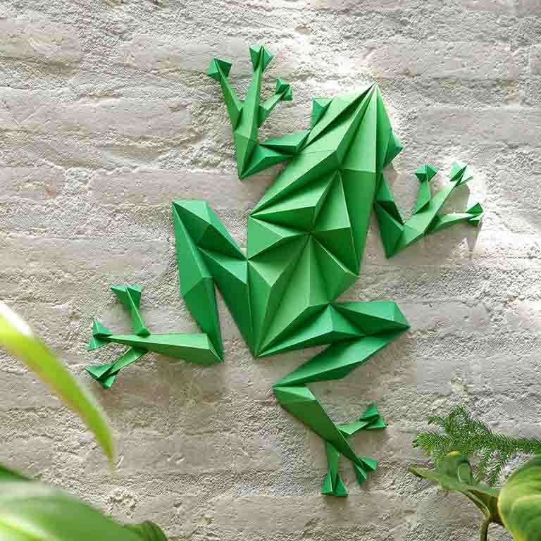 Colorful Frog Wall Art paper craft kit with pre-cut pieces, showcasing a charming frog design ready for assembly.