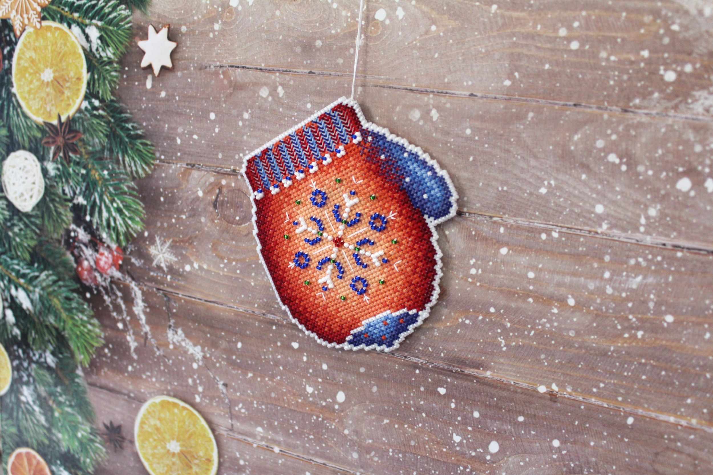 Frosty Mitten SR-457 Plastic Canvas Counted Cross Stitch Kit with colorful threads, beads, and pattern for crafting.