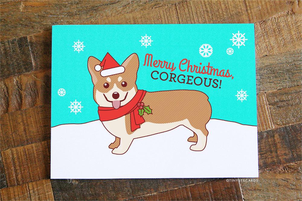 Funny Christmas card featuring a cute corgi dog in a scarf and Santa hat, perfect for holiday greetings.