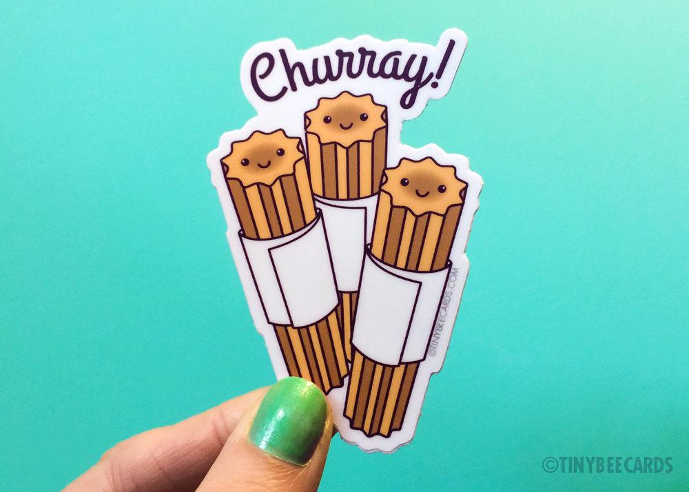 Funny Churro Vinyl Sticker featuring a happy churro character and the text 'Churray!' in vibrant colors.