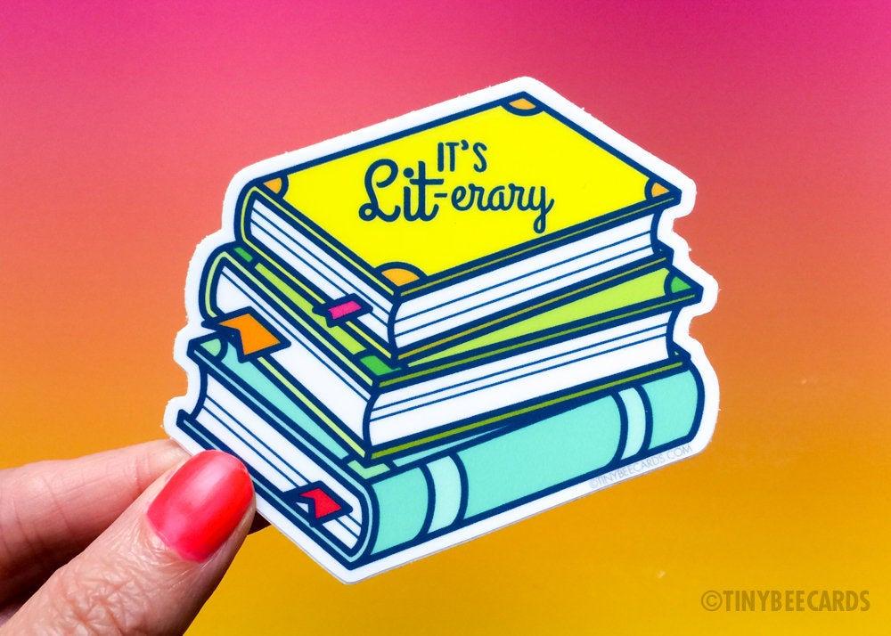 Funny Literary Books Vinyl Sticker featuring a stack of books and the pun text 'It's LIT-erary', perfect for book lovers.