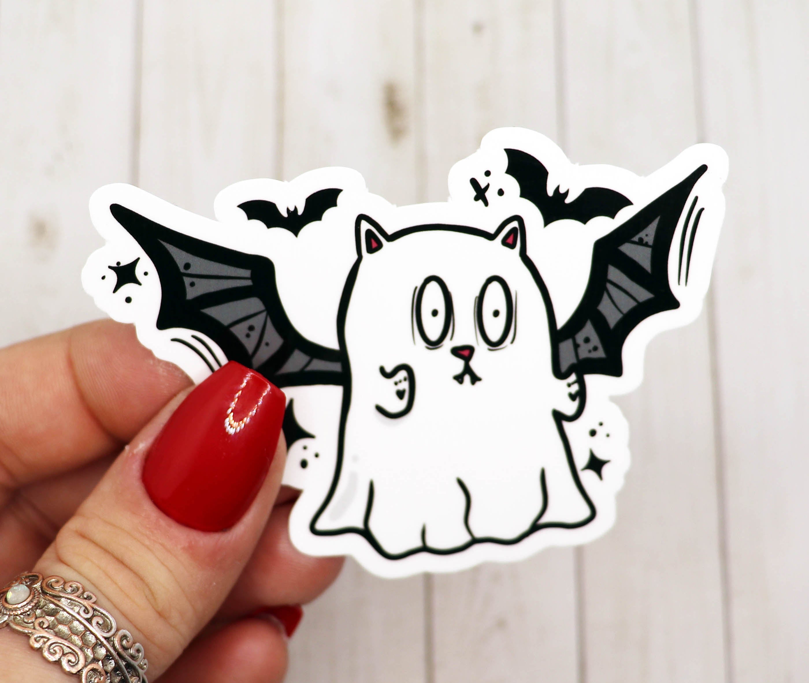 Ghost Cat Bat Vinyl Sticker featuring a whimsical ghost cat design with bat wings on a matte background.