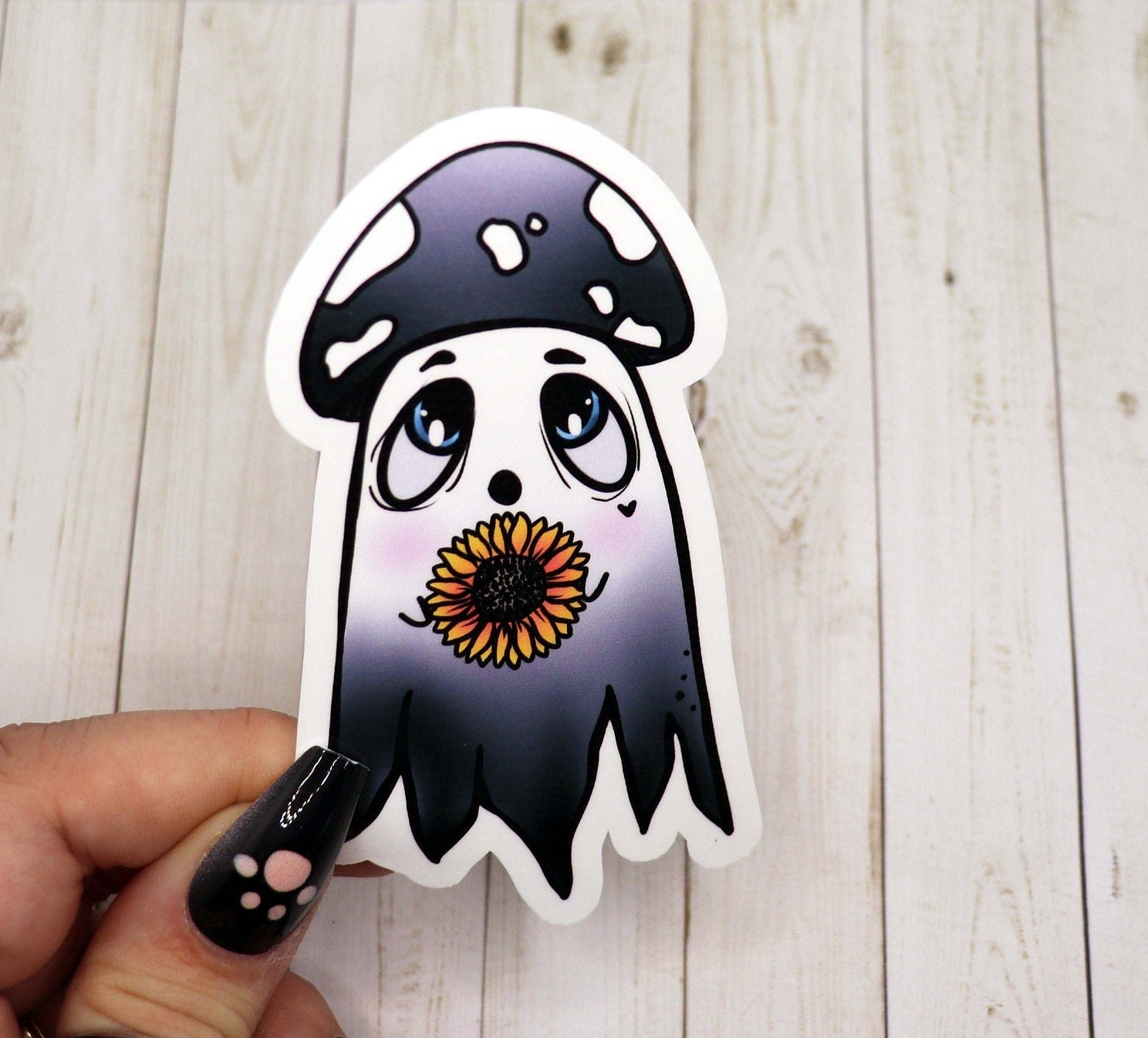 A 3-inch ghost sticker made of matte vinyl, featuring a spooky design, perfect for personalizing various items.