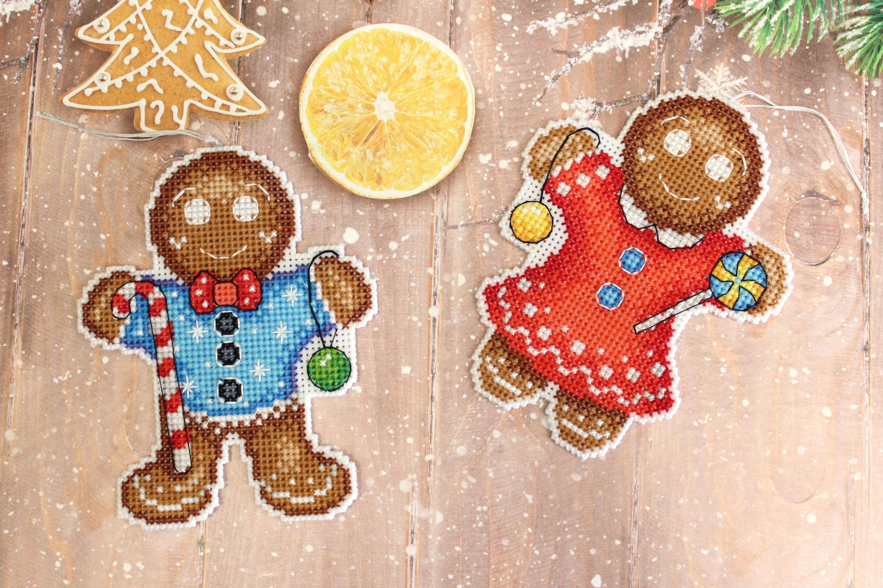 Gingerbread Cookie SR-583 Plastic Canvas Counted Cross Stitch Kit featuring colorful threads and plastic canvas for crafting.