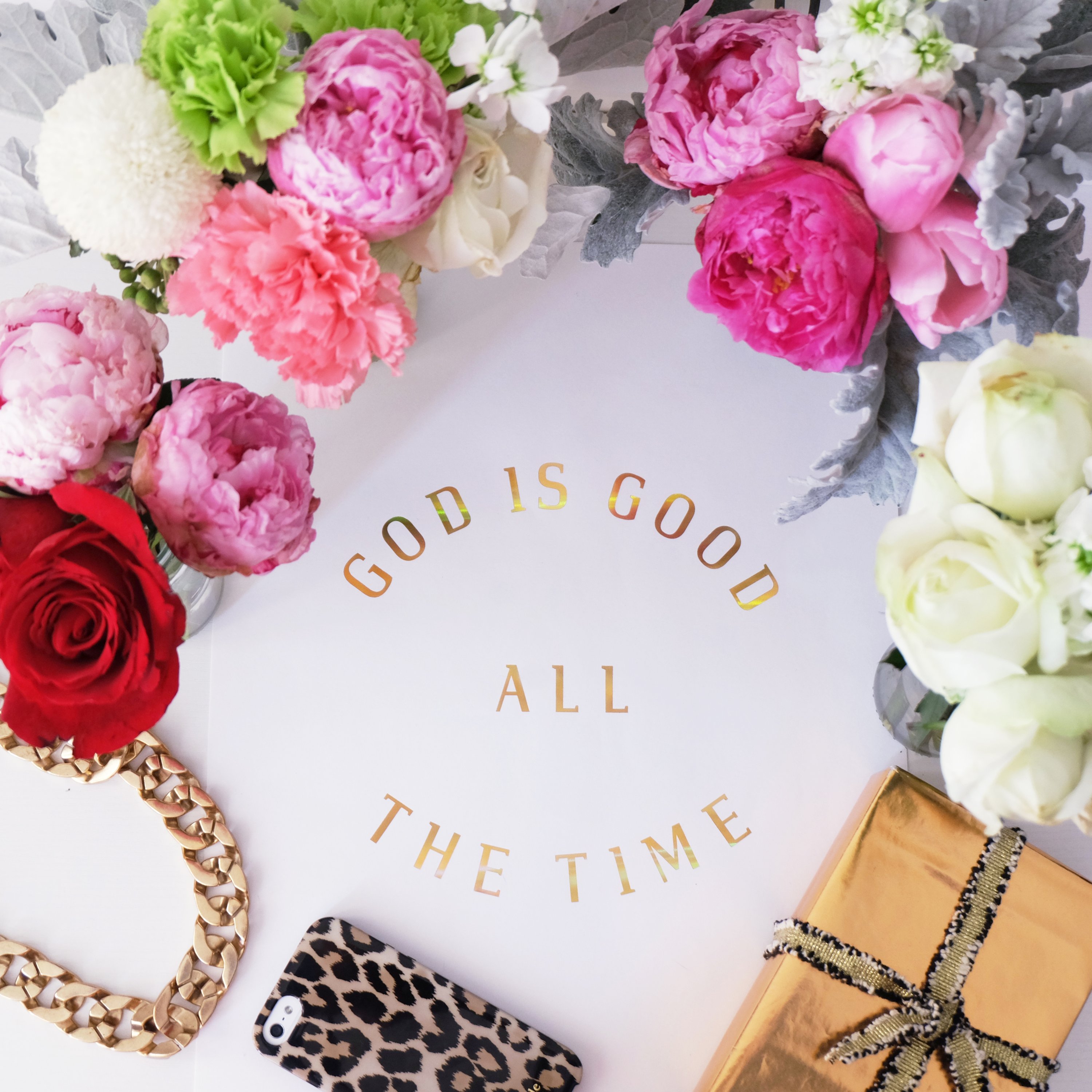 A beautiful print featuring the phrase 'God is Good All The Time' in hologram gold foil on soft ivory stock, perfect for inspiring decor.