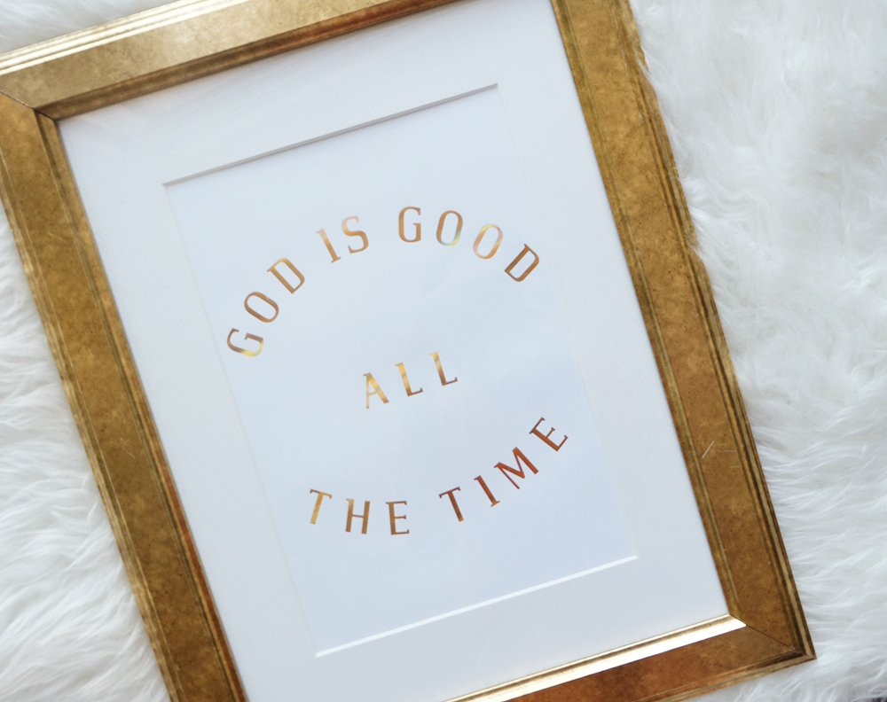 A beautiful print featuring the phrase 'God is Good All The Time' in hologram gold foil on soft ivory stock, perfect for inspiring decor.