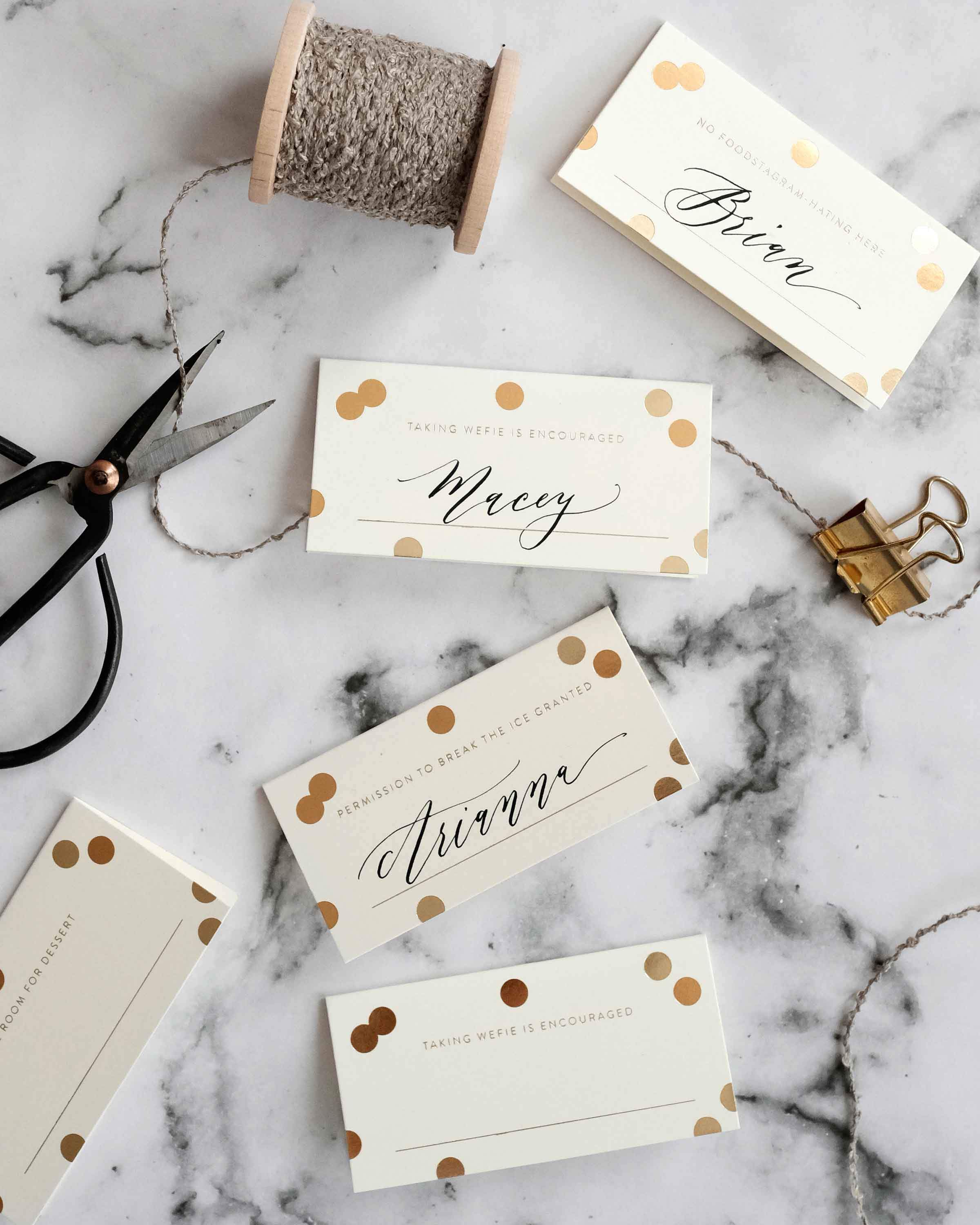 A set of 8 Gold Confetti Place Cards featuring elegant gold foil accents and unique designs, perfect for weddings and parties.