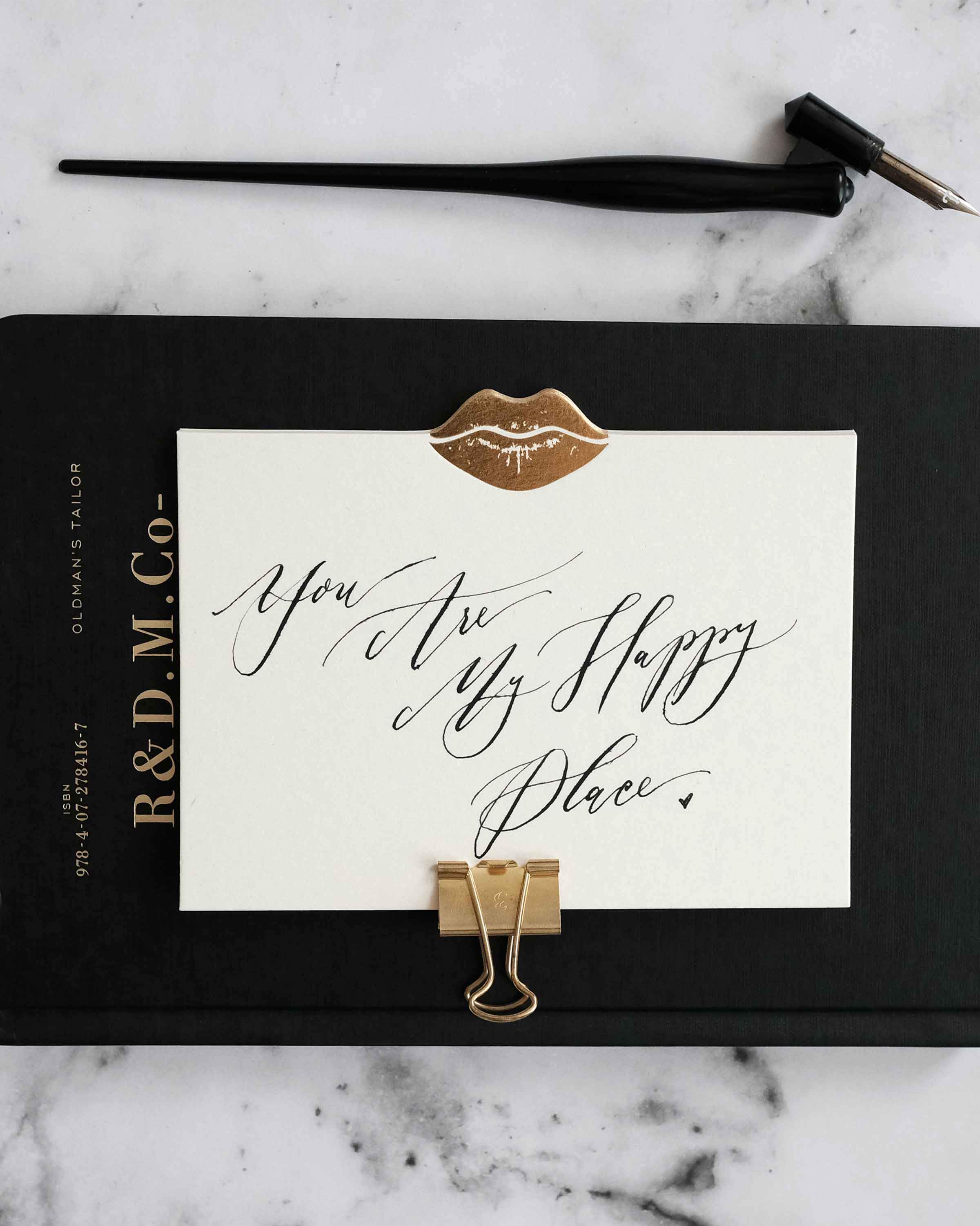 Set of Gold Kiss Notecards featuring gold foil accents and lined envelopes.