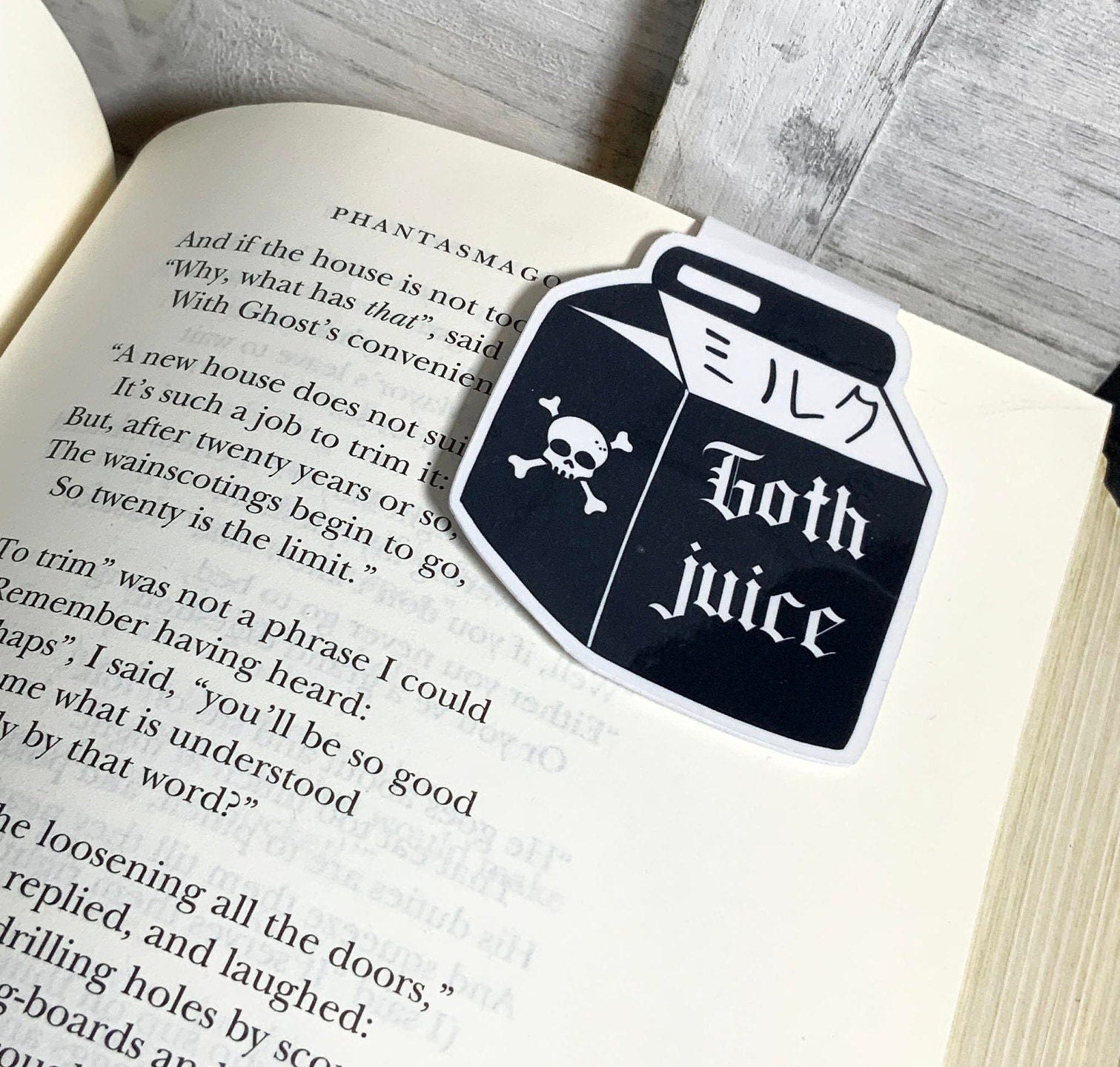 Goth Juice Magnetic Bookmark featuring a unique gothic design, double-sided, and strong magnets for secure page holding.