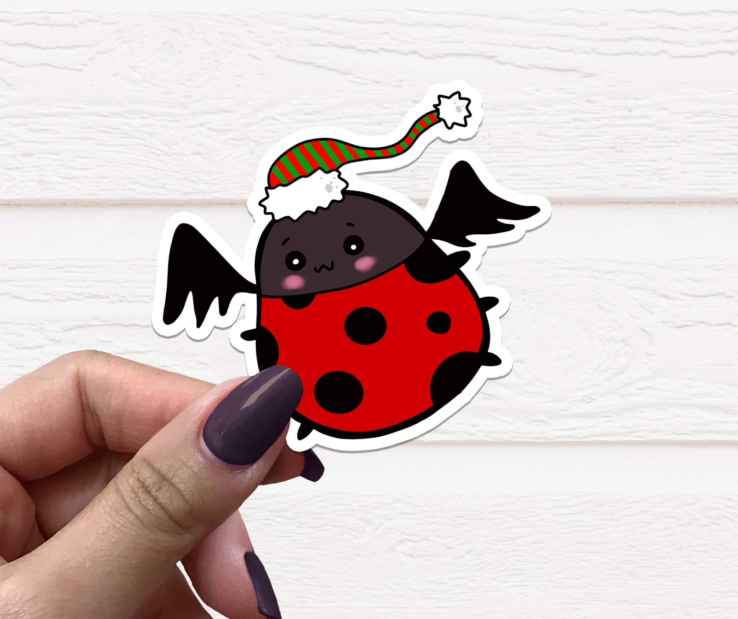 Gothic Christmas Ladybug Vinyl Sticker featuring a whimsical design, perfect for holiday decorations and personal items.