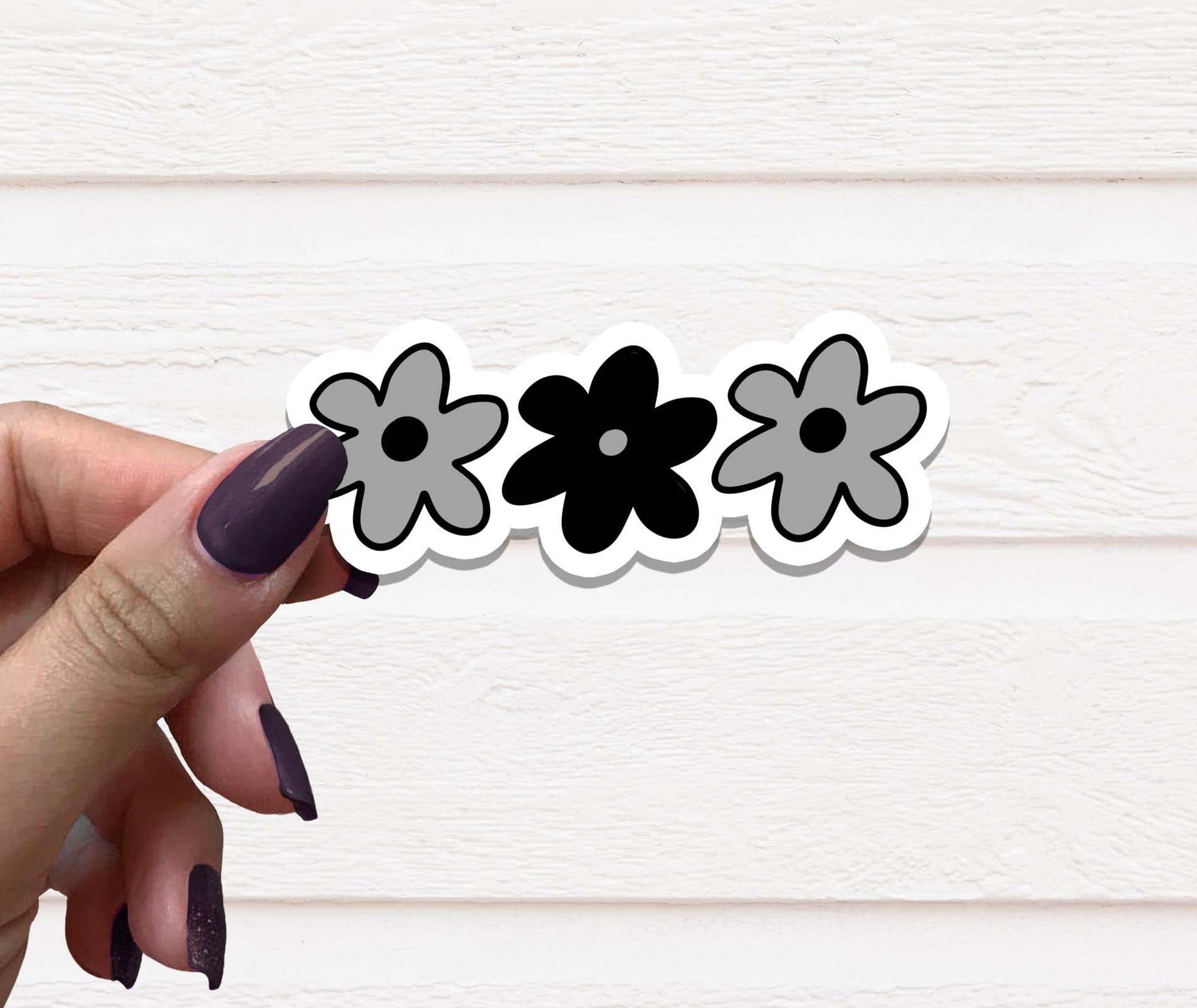 A beautifully designed Gothic Flowers Vinyl Sticker featuring intricate floral patterns with gothic elements, perfect for personalizing various items.